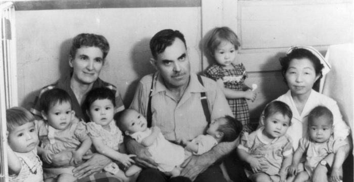 Holt with 8 orphans